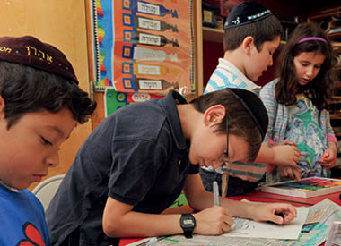 Jewish children learning together in a classroom